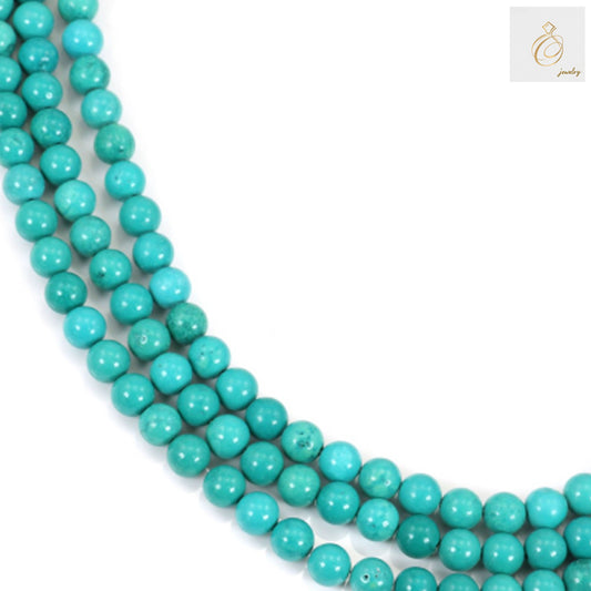 4mm reconstituted turquoise round beads on strand showing natural blue color variations and smooth finish