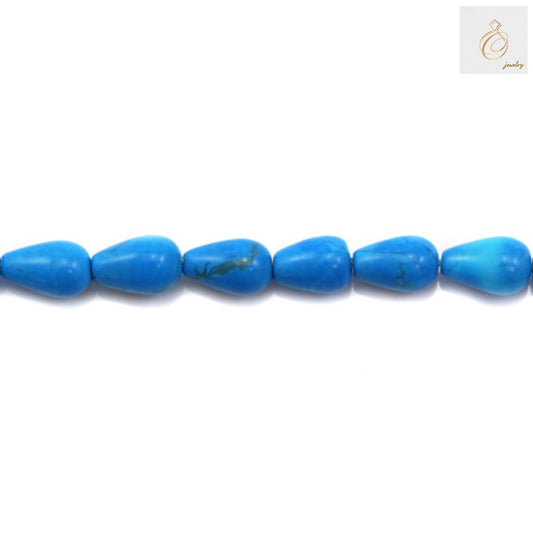 Close-up view of reconstituted turquoise drop shaped beads 5x8mm for crafting
