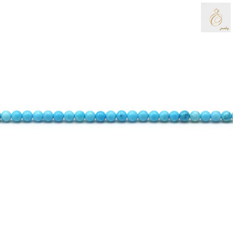 Close-up view of 2mm turquoise gemstone beads showing consistent round shape and color