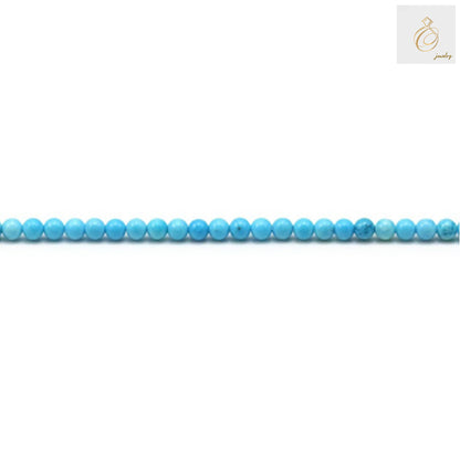 Close-up view of 2mm turquoise gemstone beads showing consistent round shape and color