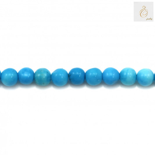 Close-up view of 3mm reconstituted turquoise round beads showing uniform size and color
