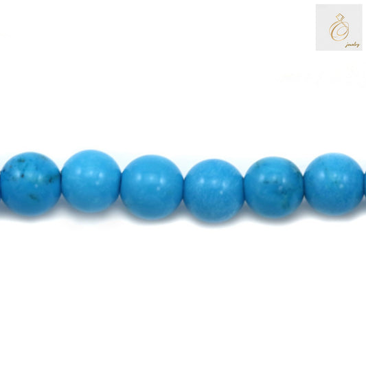 Close-up view of 4mm reconstituted turquoise round beads showing texture and color