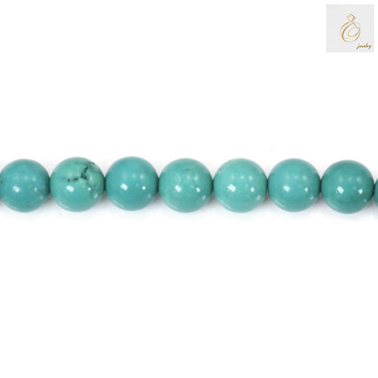 Close-up view of 4mm turquoise round beads displaying consistent size and 0.8mm hole diameter for jewelry making
