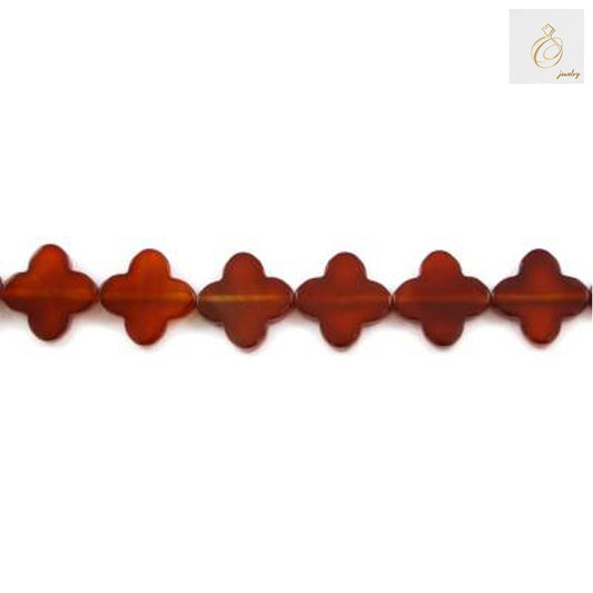 Close-up view of red agate four-leaf clover shaped beads 10mm size
