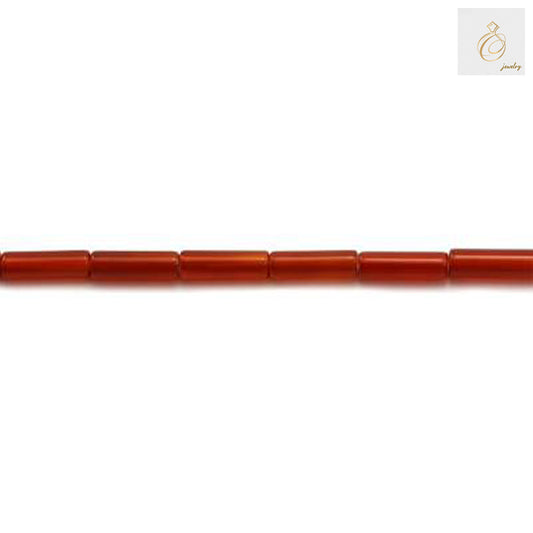 Close-up view of red agate cylinder beads displaying natural stone texture and uniform 4x13mm dimensions