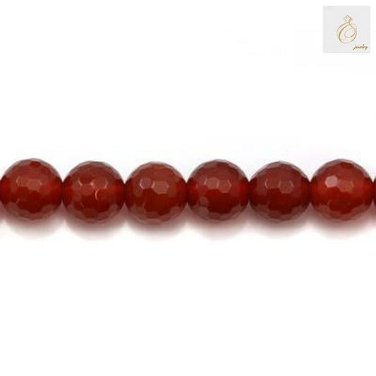 Close-up view of red agate faceted round beads showing brilliant cut and natural stone texture