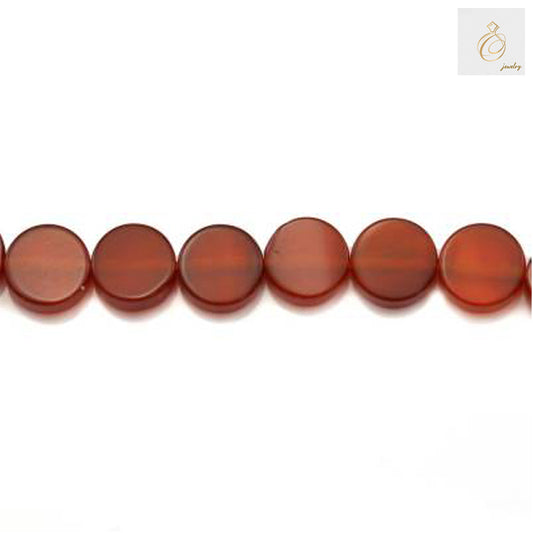 Close-up detail of red agate flat round beads showing smooth polished surface and consistent sizing
