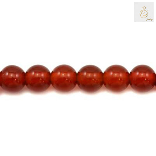 Close-up view of red agate round beads 3mm size displaying natural stone texture and consistent bead quality
