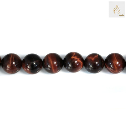 Close-up view of Red Tiger's Eye beads showing natural chatoyancy and reddish-brown color patterns