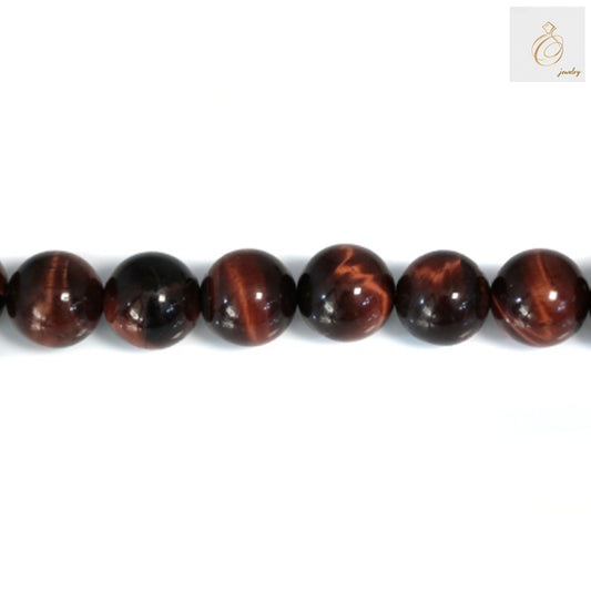 Close-up view of red tiger's eye beads showing natural stone patterns and smooth round finish, 14mm size