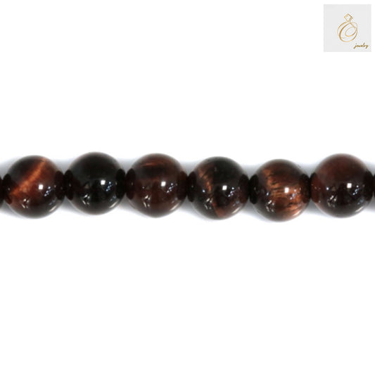 Close-up view of Red Tiger's Eye gemstone beads showing natural patterns and smooth round finish, perfect for DIY jewelry projects