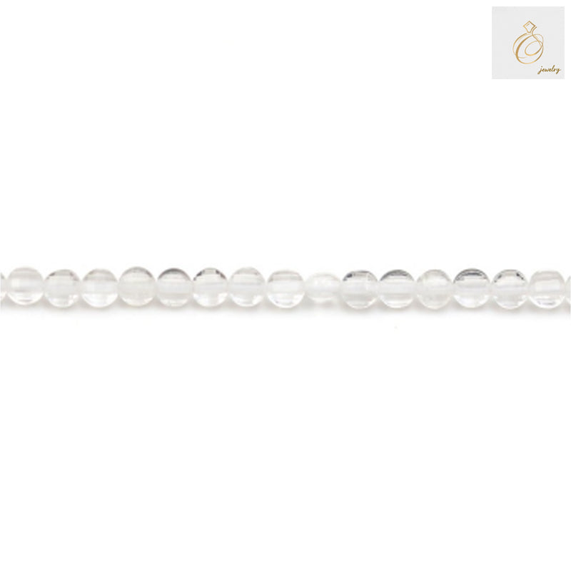 Close-up view of rock crystal faceted flat round beads showing clarity and cut quality