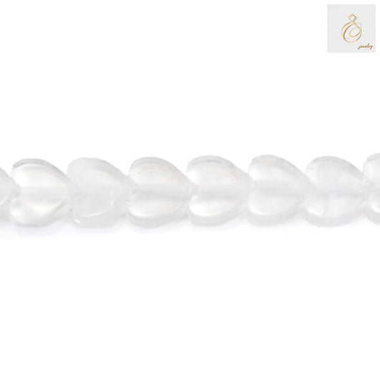 Close-up view of rock crystal heart beads displaying transparency and craftsmanship