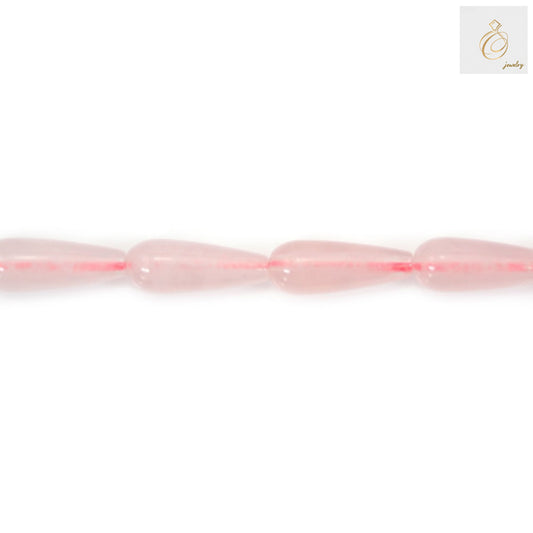 Close-up view of pink rose quartz teardrop shaped gemstone beads showing natural color variations