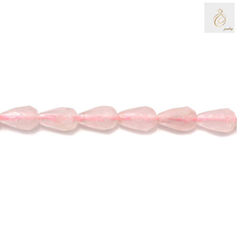 Close-up view of rose quartz faceted teardrop beads showing natural pink color and brilliant faceted cut