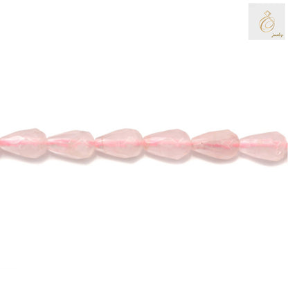Close-up view of rose quartz faceted teardrop beads showing natural pink color and brilliant faceted cut