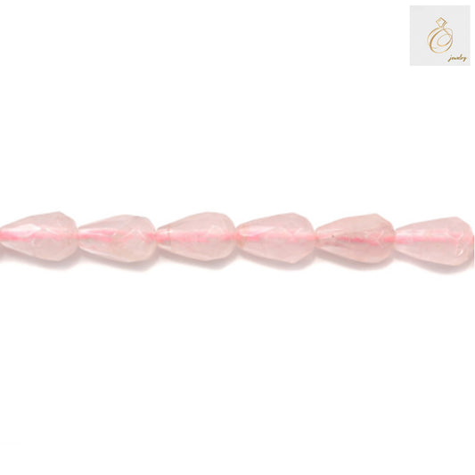 Close-up view of rose quartz faceted teardrop beads showing natural pink color and brilliant faceted cut