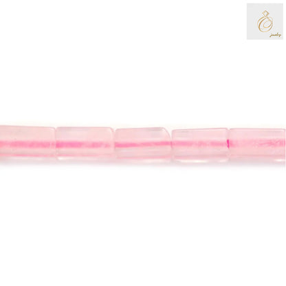 Close-up view of rose quartz rectangle gemstone beads showing pink color and uniform 2x4mm size