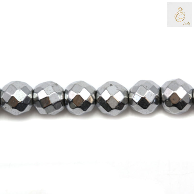 Silver hematite faceted round beads 6mm diameter with metallic luster, arranged on strand for jewelry making