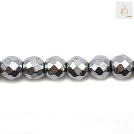 Silver hematite faceted round beads 6mm diameter with metallic luster, arranged on strand for jewelry making