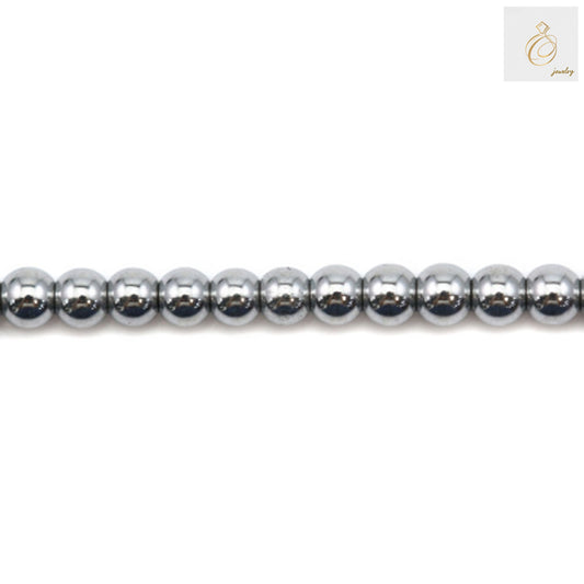 Silver hematite round beads 2mm diameter with metallic finish on white background