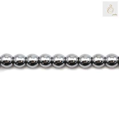 Silver hematite round beads 3mm diameter on strand - close-up view showing metallic luster and uniform size