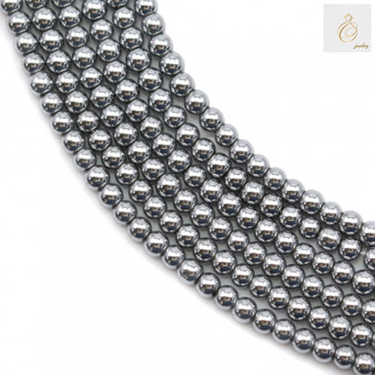 Close-up view of silver hematite beads 2mm showing uniform round shape and lustrous surface