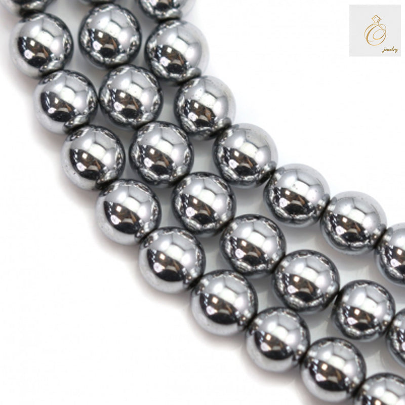 Close-up view of silver hematite round gemstone beads showing lustrous metallic surface and uniform 6mm size