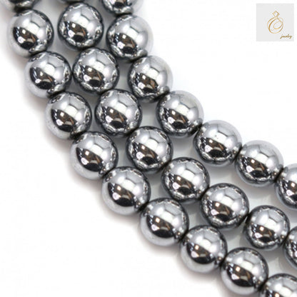 Close-up view of silver hematite round gemstone beads showing lustrous metallic surface and uniform 6mm size