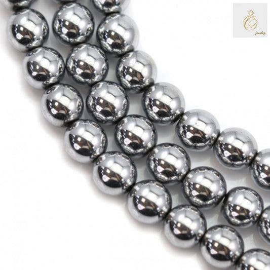 Close-up view of silver hematite round gemstone beads showing lustrous metallic surface and uniform 6mm size