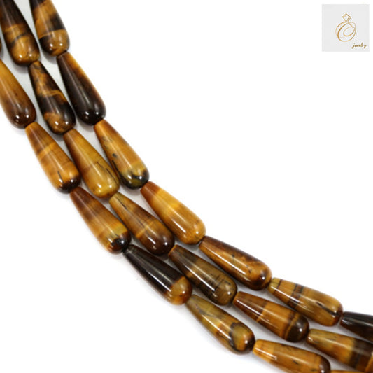 Natural Tiger's Eye drop beads 6x16mm showing golden brown chatoyancy and smooth finish"
"Premium Tiger's Eye gemstone beads in teardrop shape for jewelry making"
"Close-up of natural Tiger's Eye drop beads displaying characteristic golden striped patterns