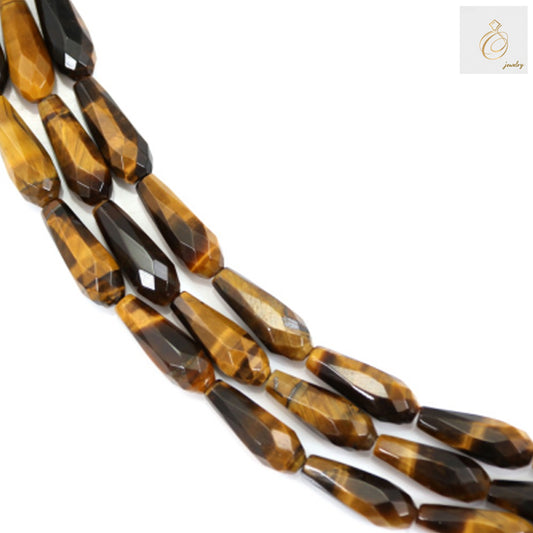Tiger's Eye Faceted Drop Beads 6x16mm - Natural golden-brown gemstone strand showing individual bead details and chatoyancy effect