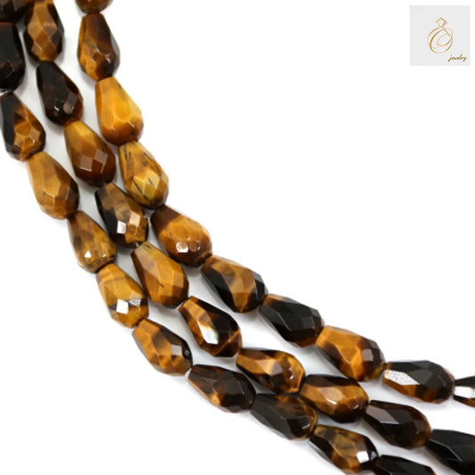 Tiger's Eye faceted drop beads 6x9mm natural gemstone strand for jewelry making"
"Natural Tiger's Eye gemstone beads with golden brown chatoyancy, faceted drop shape"
"Premium Tiger's Eye beads strand showing natural golden bands and faceted surface