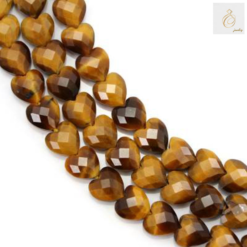 Tiger's Eye faceted heart beads 8mm on full strand showing golden-brown chatoyancy and precision cut facets