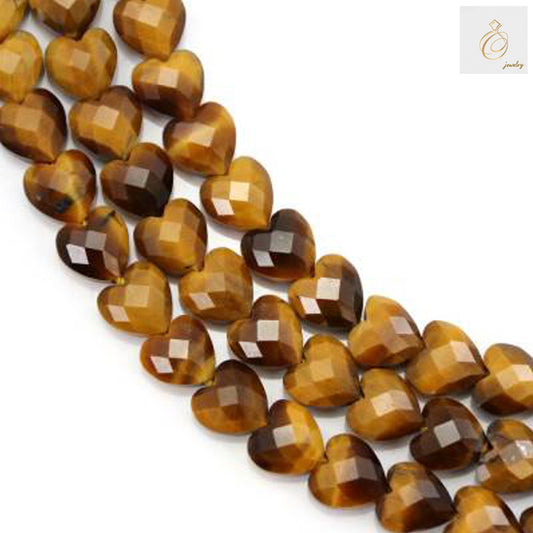 Tiger's Eye faceted heart beads 8mm on full strand showing golden-brown chatoyancy and precision cut facets