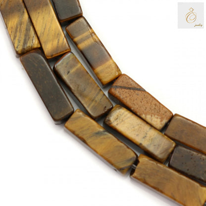 Natural tiger's eye rectangle beads 4x13mm on strand, displaying golden-brown chatoyancy and smooth polished surface