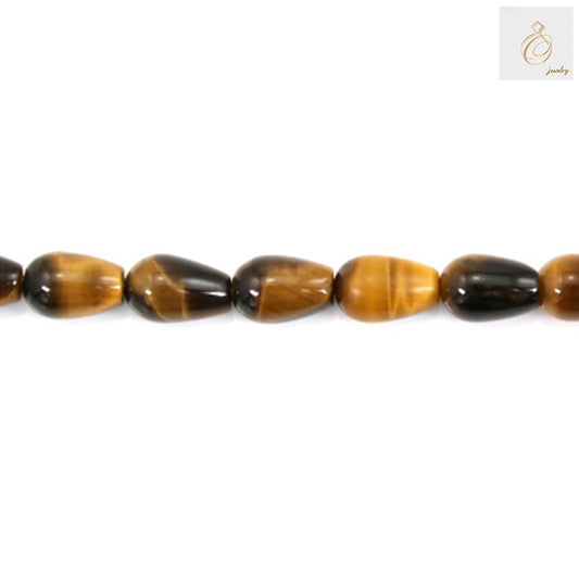 Close-up view of tiger's eye gemstone drop beads displaying natural banding patterns and lustrous surface