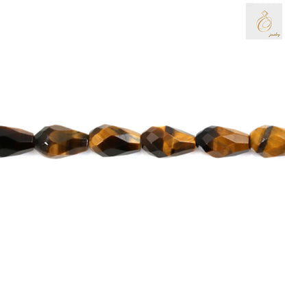Close-up view of Tiger's Eye faceted drop beads showing natural stone texture"
"Tiger's Eye gemstone beads detail highlighting 6x9mm size and 0.9mm hole"
"Natural Tiger's Eye beads displaying characteristic golden brown striping