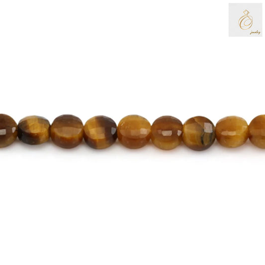 Close-up view of 4mm tiger's eye faceted round gemstone beads displaying natural golden luster and smooth finish