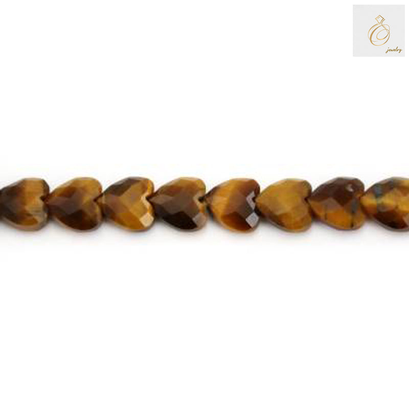 Close-up view of Tiger's Eye heart-shaped gemstone beads displaying natural golden striations and polished surface