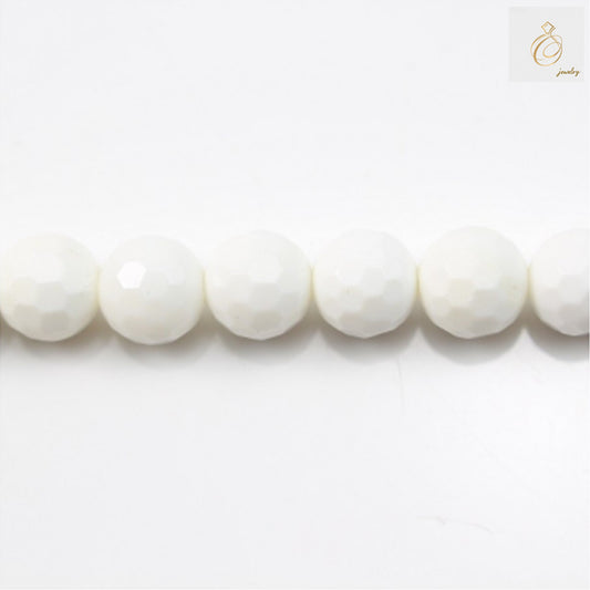 Tridacna shell faceted round beads 10mm diameter on white background"