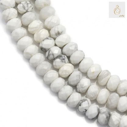 White howlite faceted abacus beads 3x4mm arranged on strand showing natural gemstone texture"
"Close-up of white howlite gemstone beads with faceted abacus cut and 0.8mm holes