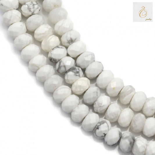 White howlite faceted abacus beads 3x4mm arranged on strand showing natural gemstone texture"
"Close-up of white howlite gemstone beads with faceted abacus cut and 0.8mm holes