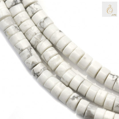 White howlite heishi beads 2x4mm arranged on strand for jewelry making"
"Natural white howlite flat disc beads with gray veining, 39-40cm strand