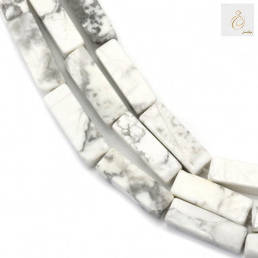 White howlite rectangle beads 4x13mm on 39-40cm strand for jewelry makingClose-up view of white howlite rectangle beads showing 4x13mm size and smooth finish