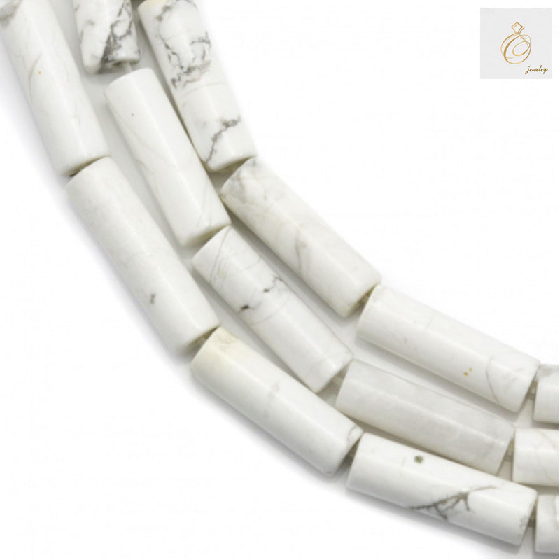 White howlite tube beads 4x13mm arranged on strand for jewelry making"
"Natural white howlite gemstone tube beads with 0.8mm holes