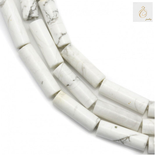 White howlite tube beads 4x13mm arranged on strand for jewelry making"
"Natural white howlite gemstone tube beads with 0.8mm holes