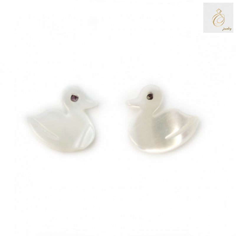 Close-up view of white mother-of-pearl duck beads displaying natural shell texture and lustrous finish