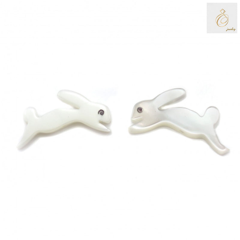 Close-up view of white mother of pearl shell rabbit beads, 8x15mm, displaying natural iridescent finish and precise rabbit carving details