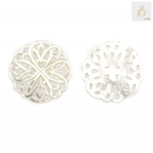 Close-up view of white mother-of-pearl shell charm showing intricate hollow floral pattern detail